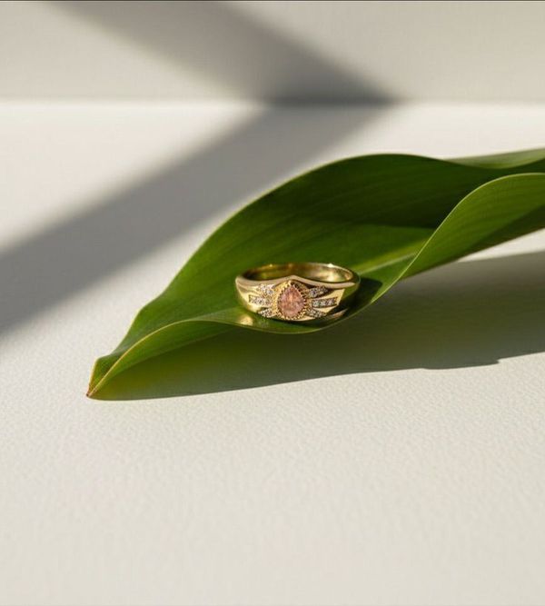 Gold ring displayed on a leaf